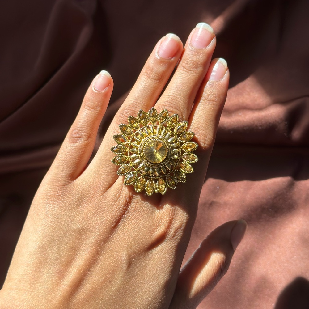 Golden alloy ring with amber stone